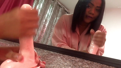 Ebony beauty plays with her small dildo on webcams