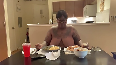 Busty brunette in a solo video is smoking a cigarette