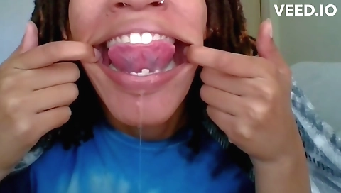 Webcam video of a black ebony girl with a huge mouth