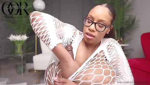 Ebony milf enjoys a big dildo in her sexy lingerie