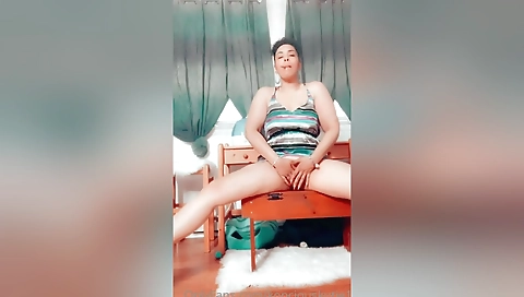 Ebony babe wearing red bikini flashes her sexy pussy