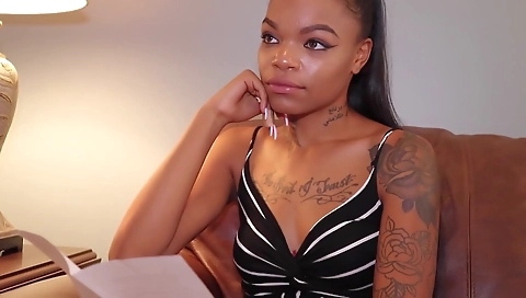 Ebony babe in a black lingerie is on the shower floor