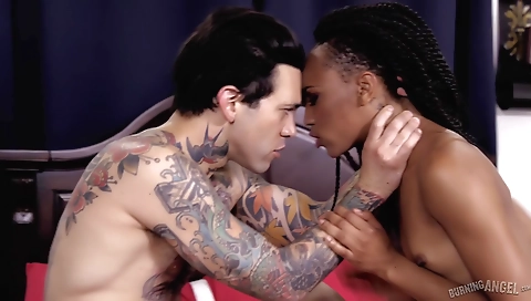 Amateur interracial threesome with a tattooed chick